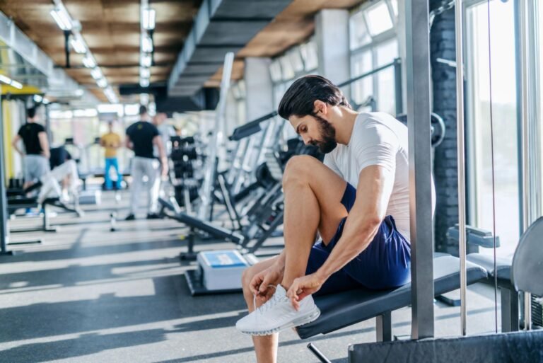 Person preparing for a workout as part of a consistent fitness routine.
